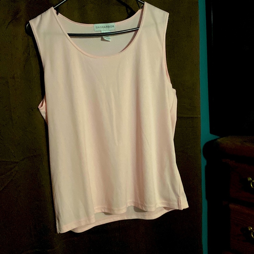 Light pink silky feel tank for layering for work outfits.